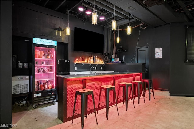 10565 Valley View Rd, Sagamore Hills, OH 44067 - indoor wet bar with concrete floors and decorative light fixtures