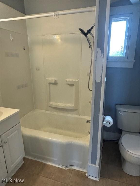 full bath with toilet, tile patterned flooring, bathtub / shower combination, and vanity