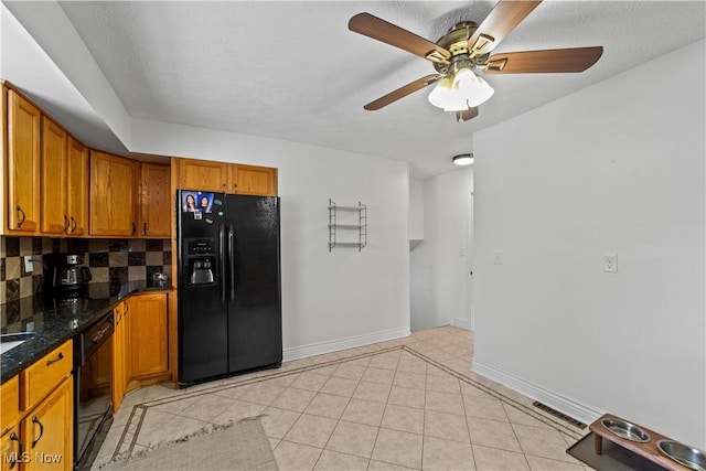 kitchen with tasteful backsplash, brown cabinets, black refrigerator with ice dispenser, and visible vents