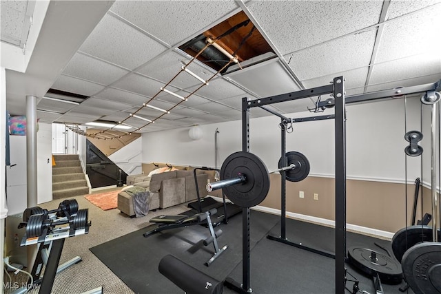 exercise area featuring a paneled ceiling