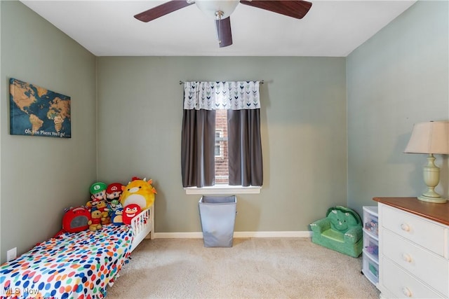 bedroom featuring a ceiling fan, carpet, and baseboards