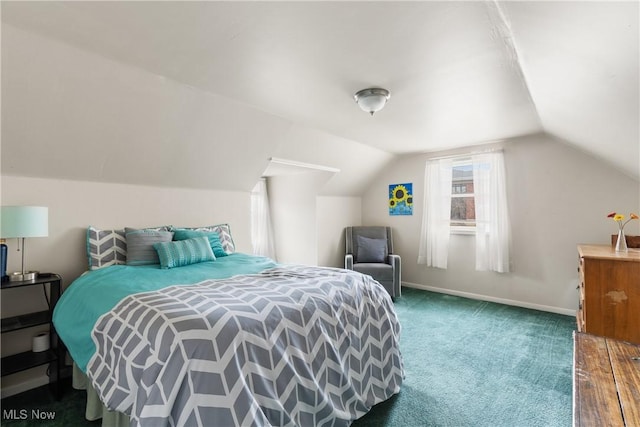 carpeted bedroom with lofted ceiling and baseboards