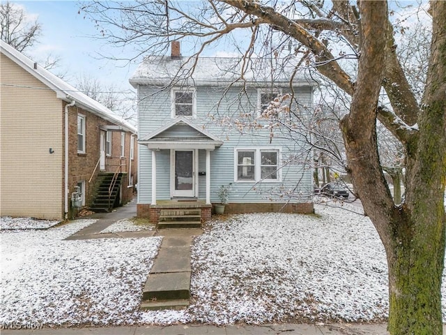 view of front of home featuring a chimney