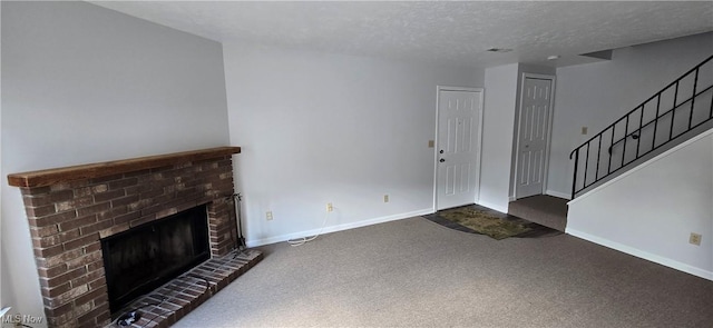 interior space featuring a fireplace, baseboards, a textured ceiling, and carpet flooring