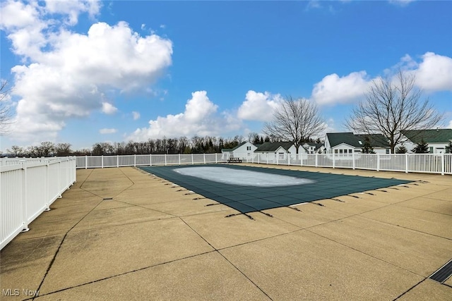 pool featuring a patio area and fence