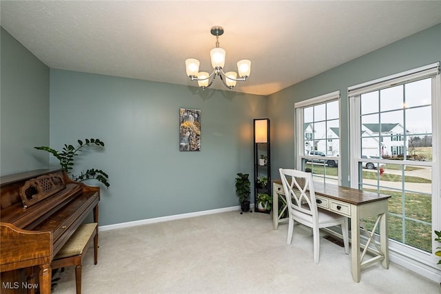 home office featuring baseboards, a textured ceiling, an inviting chandelier, and light colored carpet