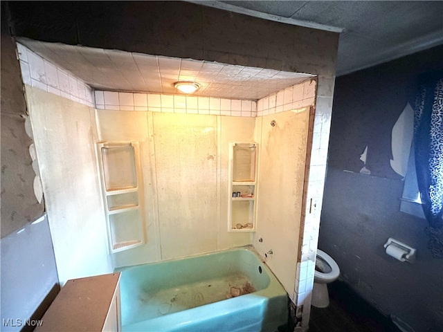 bathroom with tub / shower combination and toilet