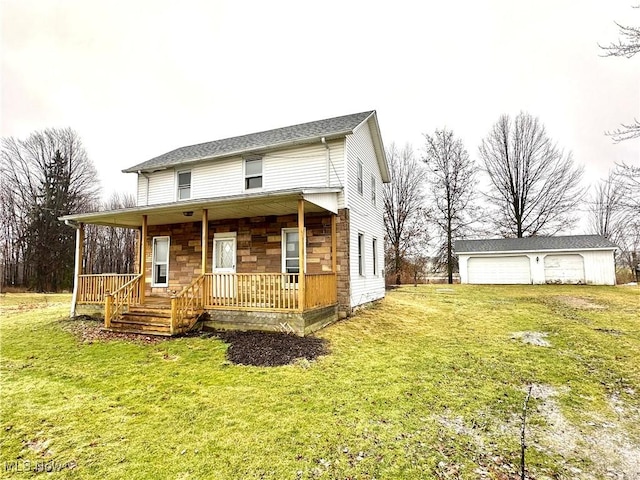 exterior space featuring a porch, a garage, an outdoor structure, stone siding, and a front yard