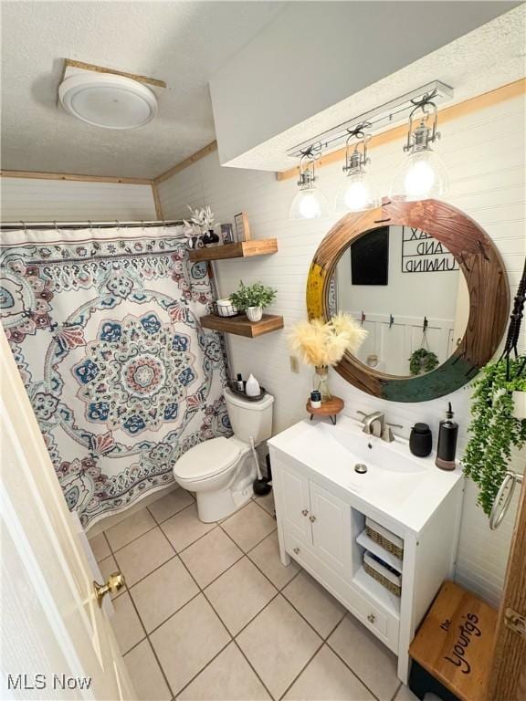 full bath with tile patterned flooring, toilet, vanity, and a shower with shower curtain