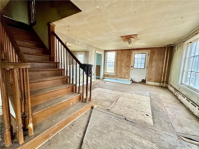 interior space with stairway and a ceiling fan