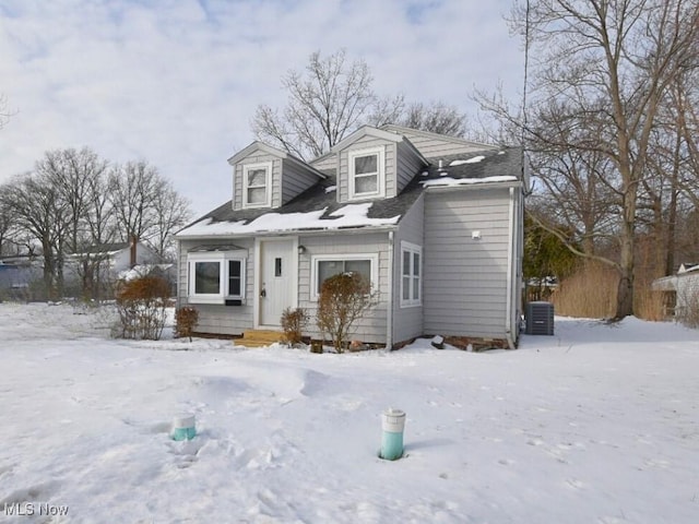 cape cod house featuring central AC