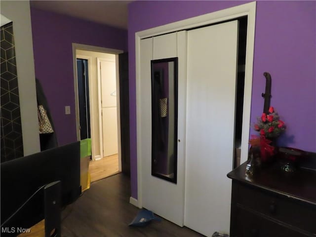 bedroom with dark wood-type flooring