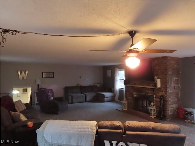 carpeted living area featuring ceiling fan and a fireplace