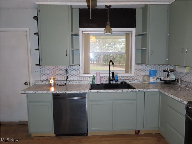 kitchen featuring open shelves, tasteful backsplash, a sink, and dishwashing machine