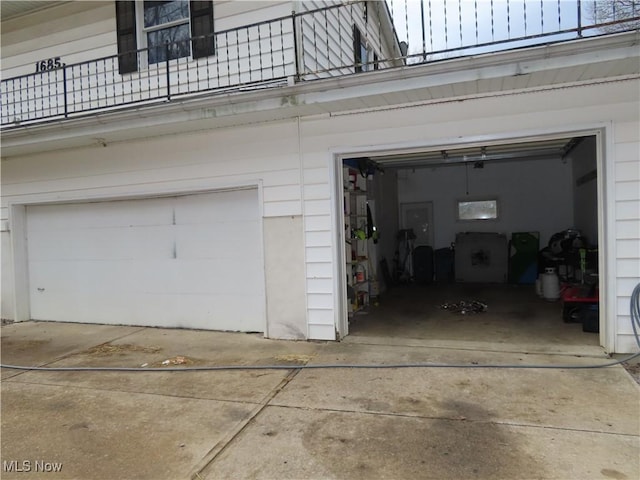 garage with concrete driveway