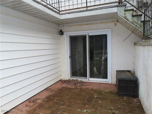 entrance to property with a patio area