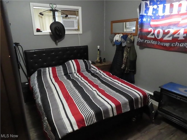 bedroom featuring wood finished floors