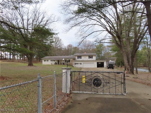 view of gate with a lawn and fence