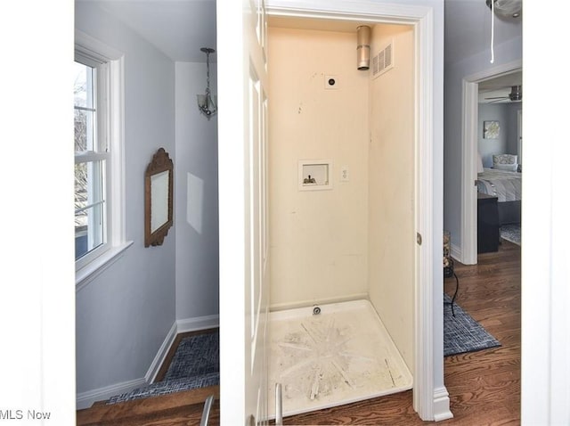 bathroom with visible vents, baseboards, and wood finished floors