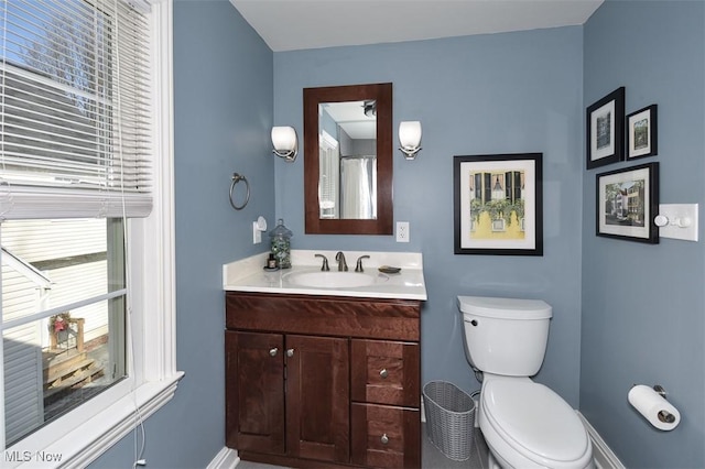 bathroom with vanity and toilet