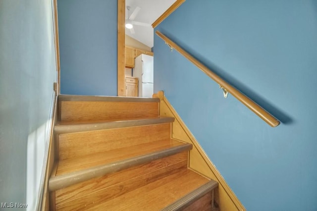 stairs with lofted ceiling