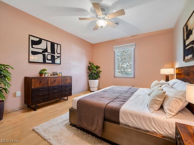 bedroom featuring a ceiling fan and light wood-style floors