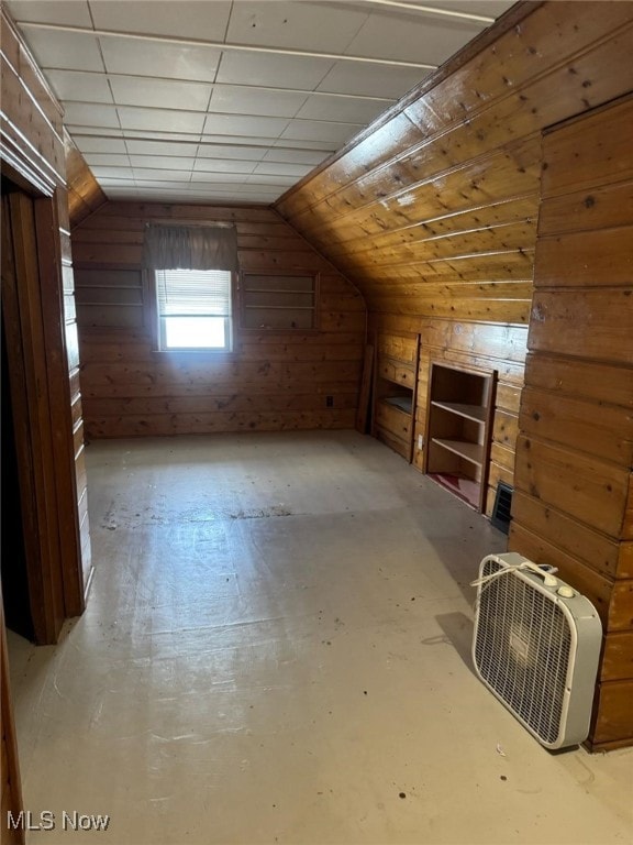 additional living space featuring lofted ceiling