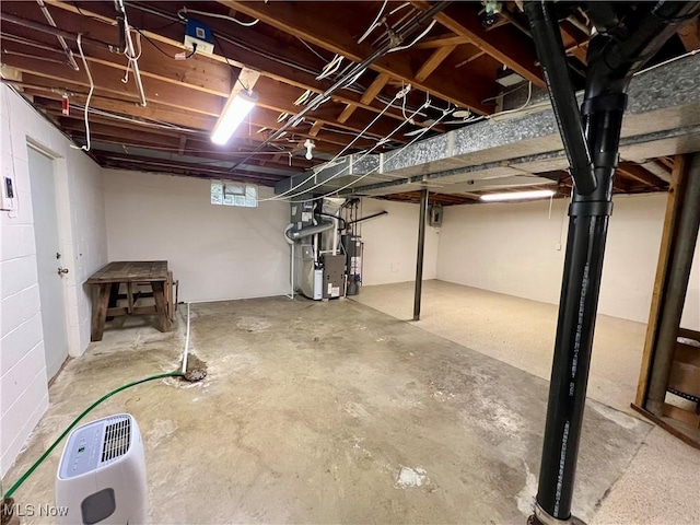 basement featuring water heater and heating unit