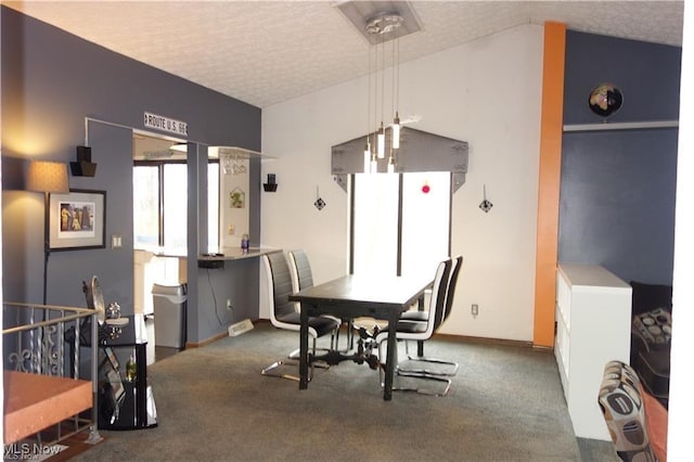 carpeted dining space featuring a textured ceiling and lofted ceiling