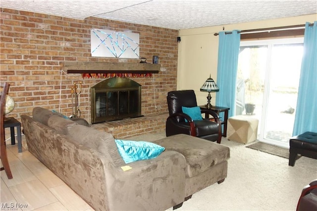 living room with a fireplace and a textured ceiling