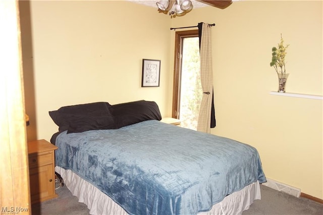 bedroom featuring carpet floors and baseboards