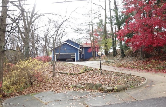 view of front of property with an attached garage and concrete driveway