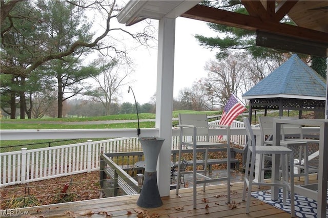 wooden deck featuring a gazebo