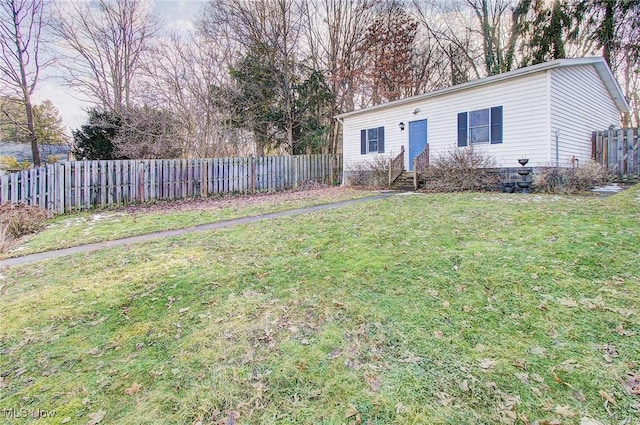 view of yard with entry steps and fence