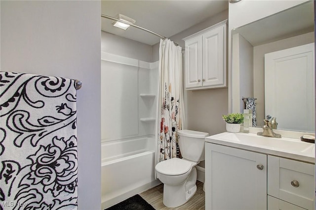 full bath featuring wood finished floors, vanity, toilet, and shower / bathtub combination with curtain