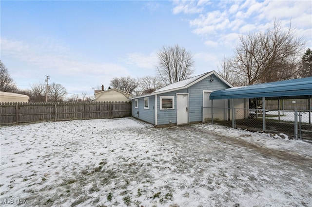 exterior space featuring fence private yard and a detached carport