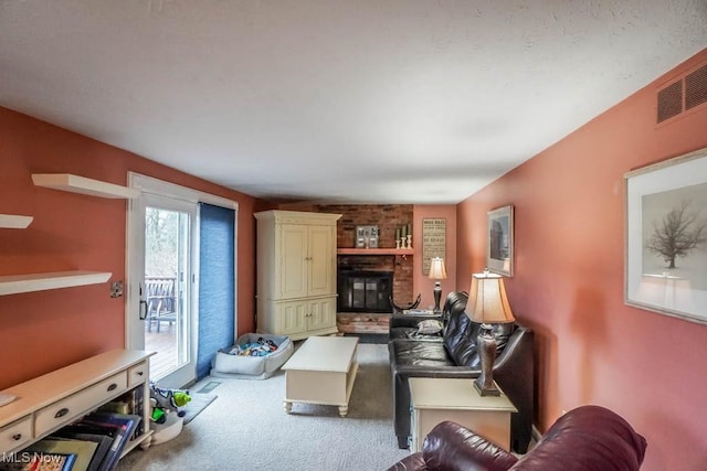 living area featuring a fireplace, carpet flooring, and visible vents