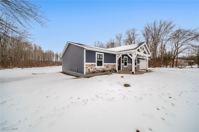 view of front of house featuring stone siding