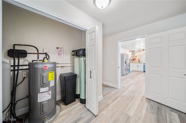 utilities featuring water heater and a sink