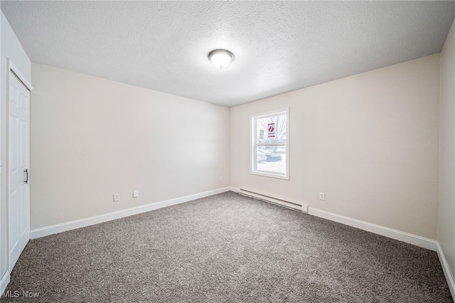 empty room featuring carpet, a textured ceiling, a baseboard radiator, and baseboards