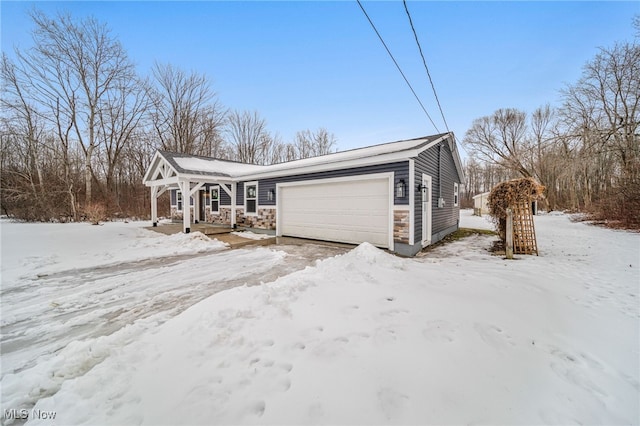 view of front facade featuring stone siding and an attached garage