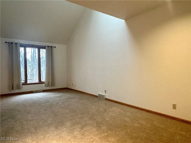 bonus room with carpet, visible vents, and baseboards