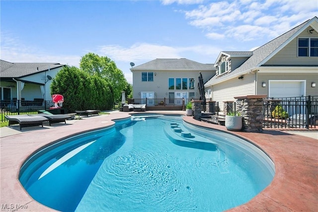 view of pool with a fenced in pool, a patio area, and fence