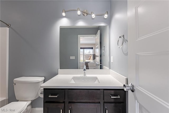 bathroom with vanity and toilet