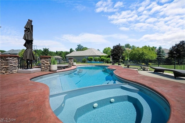 view of swimming pool featuring a fenced in pool, fence, a patio, and an in ground hot tub