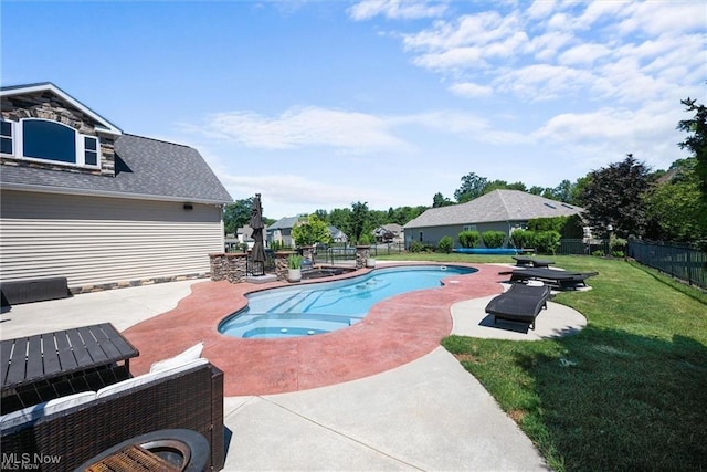 view of pool with a patio, an in ground hot tub, fence, a lawn, and a fenced in pool