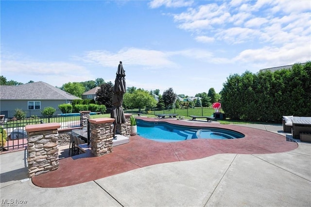 view of swimming pool with a fenced in pool, a patio area, and fence