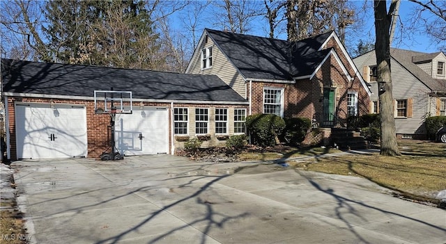 view of front of home featuring concrete driveway, brick siding, and an attached garage