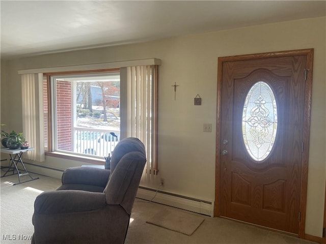 foyer with carpet floors and baseboard heating