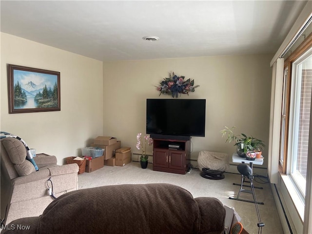 carpeted living area featuring visible vents